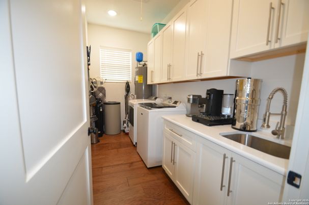 Interior, Kitchen, Recessed Lighting, Washer, Wood Texture Flooring