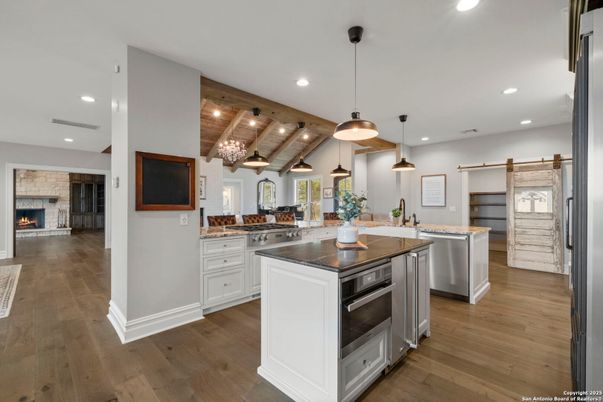 Fireplace, Interior, Kitchen, Pendant Lights, Recessed Lighting, Stainless Steel Appliances, Wooden Beams, Wooden Ceilings, Wood Texture Flooring