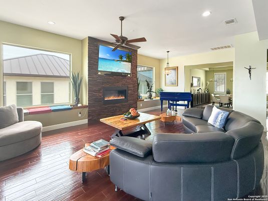 Billiard Table, Fireplace, Game Room, Interior, Living room, Pendant Lights, Recessed Lighting, Stone Walls, Wood Texture Flooring