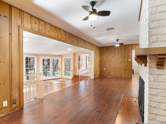 Empty room, Fireplace, Interior, Recessed Lighting, Stone Walls, Wood Texture Flooring, Wooden Walls