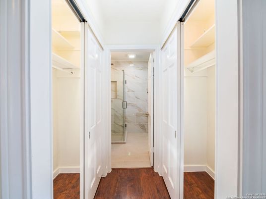 Bathroom, Glass Shower, Interior, Marble Walls, Recessed Lighting, Walk-in Closets, Wood Texture Flooring