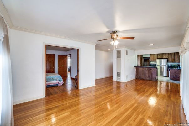 Empty room, Interior, Kitchen, Recessed Lighting, Stainless Steel Appliances, Wood Texture Flooring