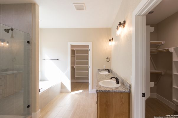 Bathroom, Dual Sink Vanities, Glass Shower, Interior, Walk-in Closets, Wood Texture Flooring