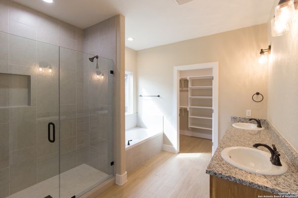 Bathroom, Dual Sink Vanities, Glass Shower, Interior, Recessed Lighting, Walk-in Closets, Wood Texture Flooring