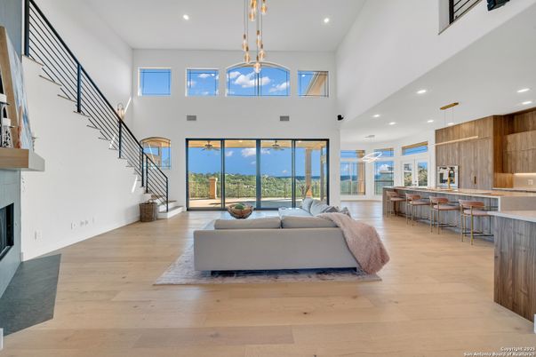 Fireplace, Interior, Kitchen, Living room, Pendant Lights, Recessed Lighting, Water, Wood Texture Flooring