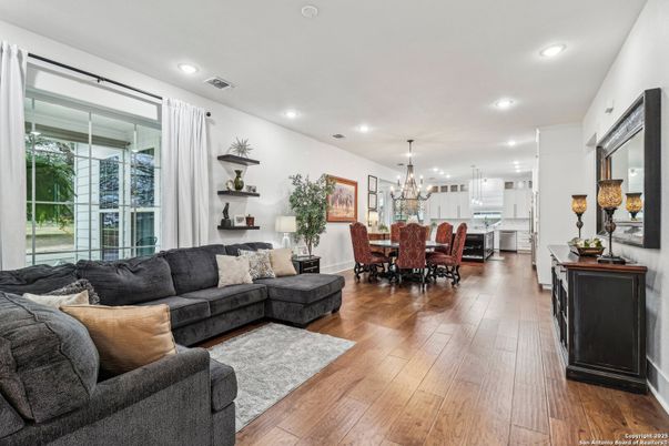 Chandelier, Dining room, Interior, Kitchen, Living room, Pendant Lights, Recessed Lighting, Stainless Steel Appliances, Wood Texture Flooring