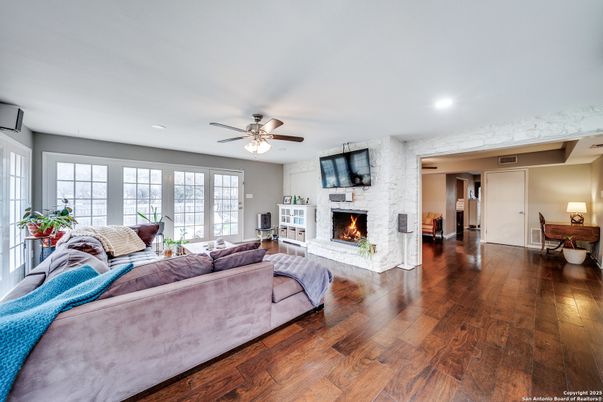Bedroom, Fireplace, Interior, Living room, Recessed Lighting, Stone Walls, Wood Texture Flooring