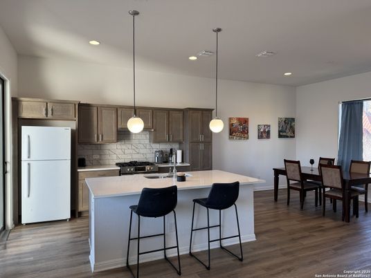 Dining room, Interior, Kitchen, Pendant Lights, Recessed Lighting, Stainless Steel Appliances, Wood Texture Flooring
