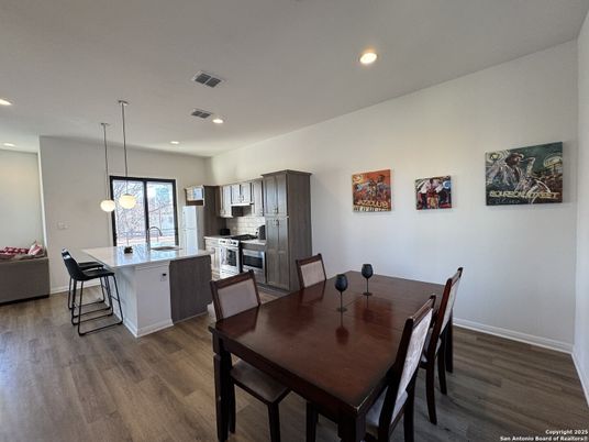 Dining room, Interior, Kitchen, Pendant Lights, Recessed Lighting, Stainless Steel Appliances, Wood Texture Flooring