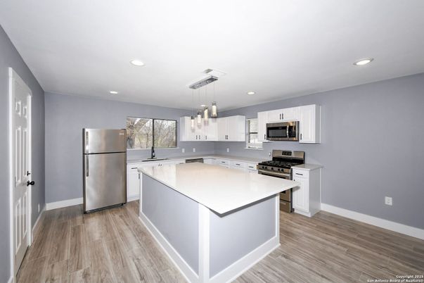 Interior, Kitchen, Pendant Lights, Recessed Lighting, Stainless Steel Appliances, Wood Texture Flooring