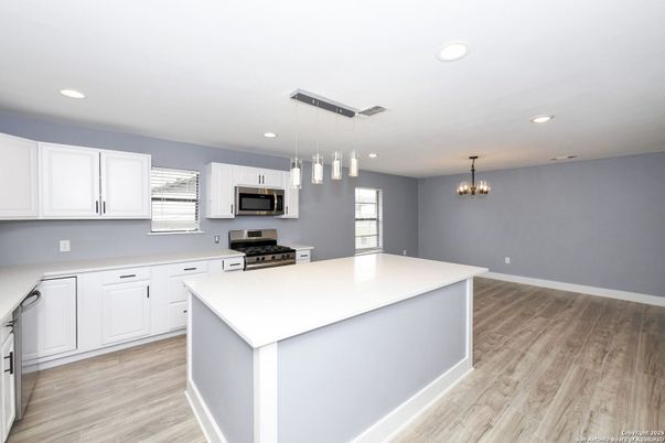 Chandelier, Interior, Kitchen, Pendant Lights, Recessed Lighting, Stainless Steel Appliances, Wood Texture Flooring
