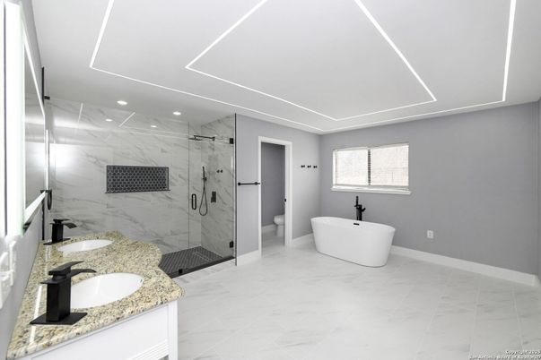 Bathroom, Dual Sink Vanities, Free Standing Baths, Glass Shower, Interior, Marble, Marble Walls, Recessed Lighting