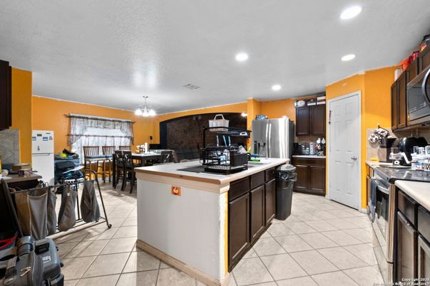 Chandelier, Dining room, Interior, Kitchen, Recessed Lighting, Stainless Steel Appliances