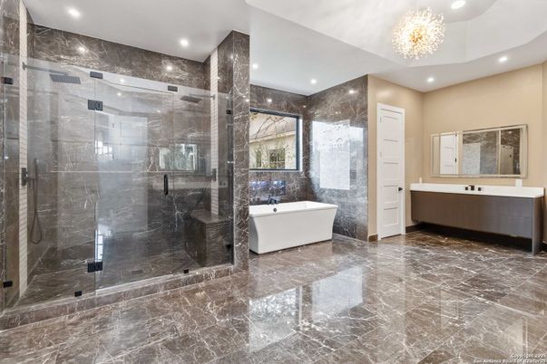 Bathroom, Chandelier, Free Standing Baths, Glass Shower, Interior, Marble, Marble Walls, Recessed Lighting