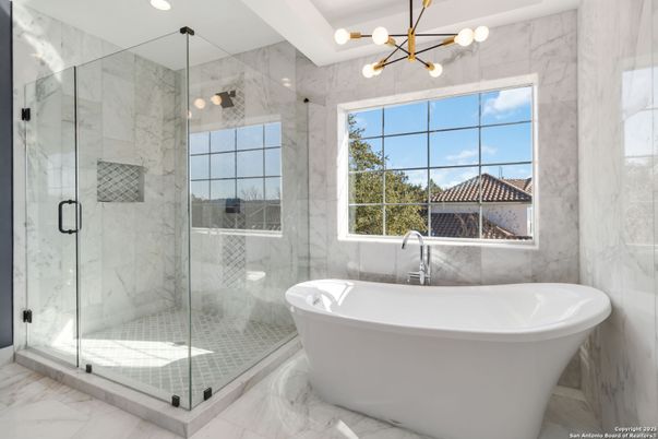 Bathroom, Free Standing Baths, Glass Shower, Interior, Marble, Marble Walls, Pendant Lights, Recessed Lighting