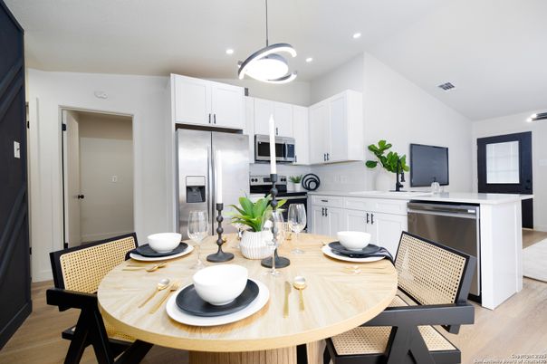 Dining room, Interior, Kitchen, Pendant Lights, Recessed Lighting, Stainless Steel Appliances, Wood Texture Flooring