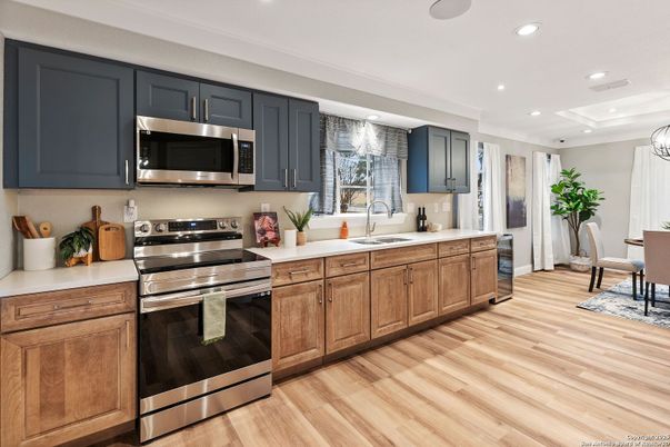 Dining room, Interior, Kitchen, Recessed Lighting, Stainless Steel Appliances, Wood Texture Flooring
