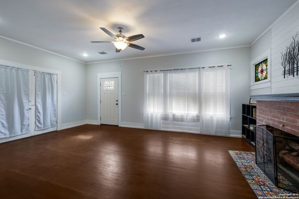 Empty room, Fireplace, Interior, Recessed Lighting, Stone Walls, Wood Texture Flooring