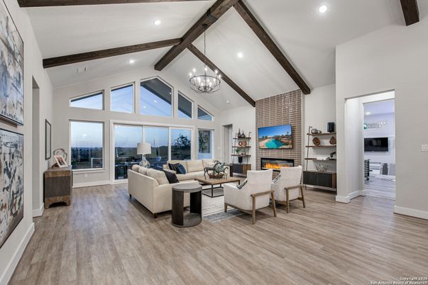 Chandelier, Fireplace, Interior, Living room, Recessed Lighting, Stone Walls, Wooden Beams, Wood Texture Flooring