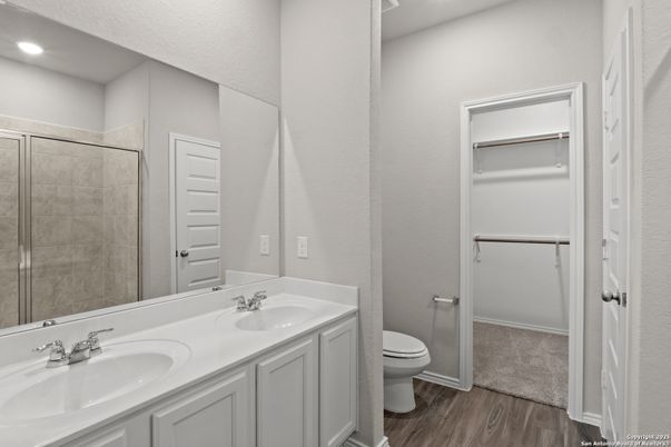 Bathroom, Dual Sink Vanities, Glass Shower, Interior, Recessed Lighting, Wood Texture Flooring