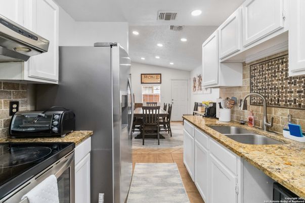 Dining room, Interior, Kitchen, Recessed Lighting, Stainless Steel Appliances, Wood Texture Flooring