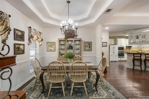Chandelier, Dining room, Interior, Kitchen, Recessed Lighting, Stainless Steel Appliances, Wood Texture Flooring