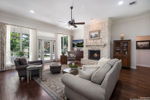Fireplace, Interior, Living room, Recessed Lighting, Stone Walls, Wood Texture Flooring