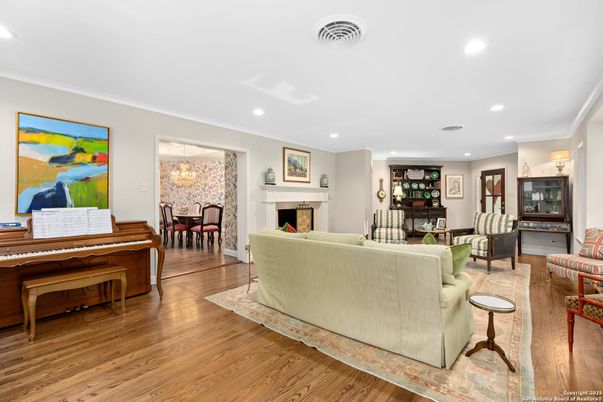 Dining room, Fireplace, Interior, Living room, Piano, Recessed Lighting, Wood Texture Flooring