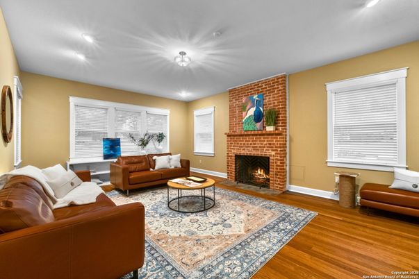 Fireplace, Interior, Living room, Recessed Lighting, Stone Walls, Wood Texture Flooring