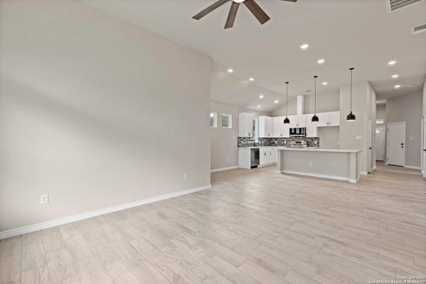 Empty room, Interior, Kitchen, Pendant Lights, Recessed Lighting, Stainless Steel Appliances, Wood Texture Flooring