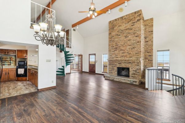 Chandelier, Fireplace, Interior, Kitchen, Stone Walls, Wood Texture Flooring