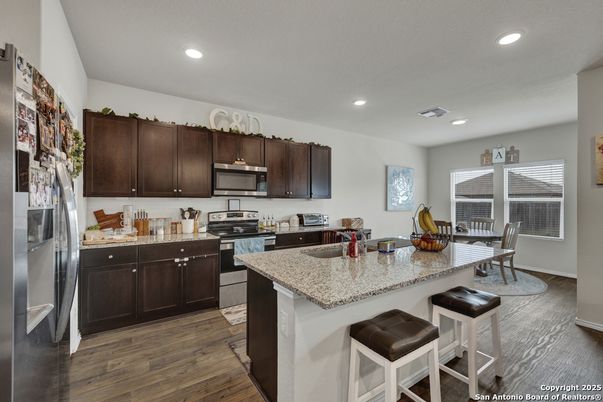 Dining room, Interior, Kitchen, Recessed Lighting, Stainless Steel Appliances, Wood Texture Flooring