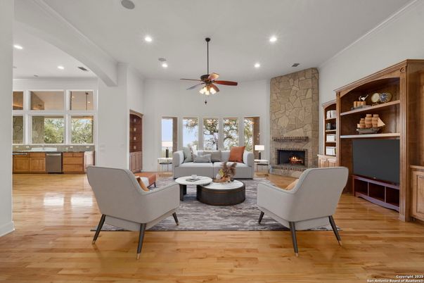 Fireplace, Interior, Living room, Recessed Lighting, Stone Walls, Wood Texture Flooring