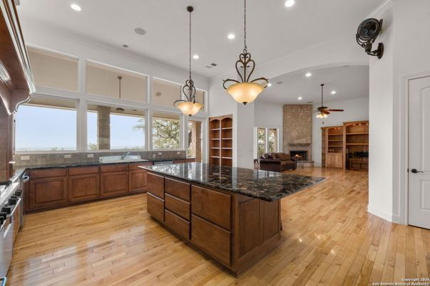 Fireplace, Interior, Kitchen, Pendant Lights, Recessed Lighting, Stone Walls, Wood Texture Flooring