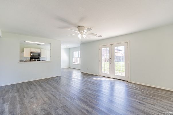 Empty room, Interior, Kitchen, Stainless Steel Appliances, Wood Texture Flooring