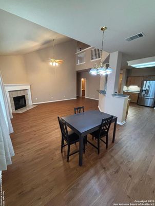 Dining room, Fireplace, Interior, Kitchen, Pendant Lights, Wood Texture Flooring