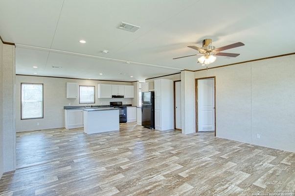 Empty room, Interior, Kitchen, Recessed Lighting, Stainless Steel Appliances, Wood Texture Flooring