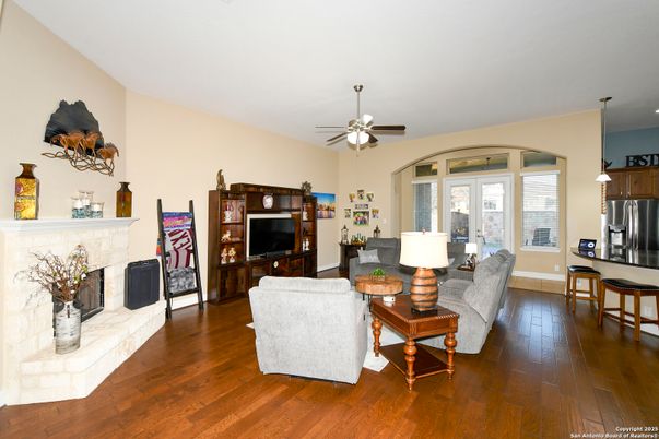 Fireplace, Interior, Kitchen, Living room, Pendant Lights, Recessed Lighting, Stainless Steel Appliances, Wood Texture Flooring