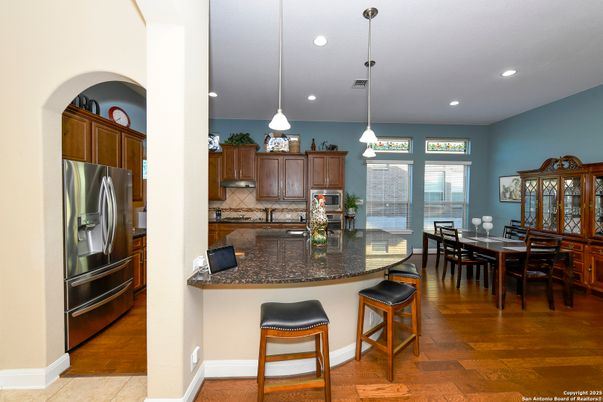 Dining room, Interior, Kitchen, Pendant Lights, Recessed Lighting, Stainless Steel Appliances, Wood Texture Flooring