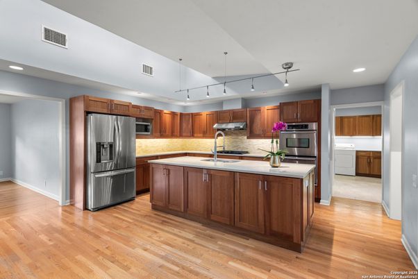 Interior, Kitchen, Recessed Lighting, Stainless Steel Appliances, Wood Texture Flooring