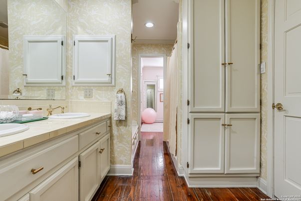 Bathroom, Dual Sink Vanities, Interior, Recessed Lighting, Tile Countertops, Wood Texture Flooring