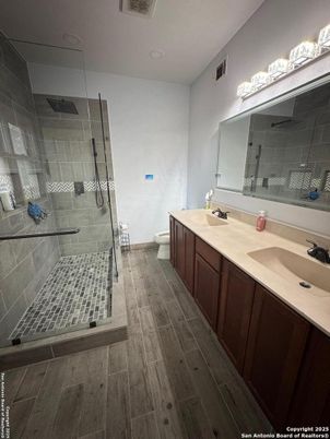 Bathroom, Dual Sink Vanities, Glass Shower, Interior, Wood Texture Flooring