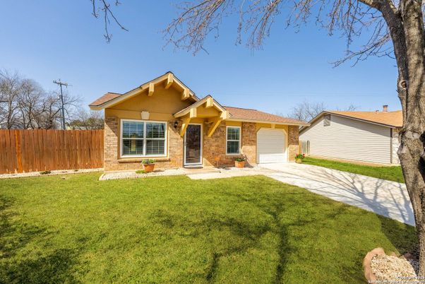 Attached, Backyard, Exterior, Facade, Brick Facade, Ranch