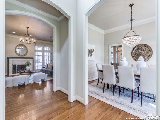 Chandelier, Dining room, Fireplace, Interior, Living room, Pendant Lights, Recessed Lighting, Wood Texture Flooring
