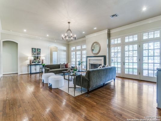 Chandelier, Fireplace, Interior, Living room, Recessed Lighting, Wood Texture Flooring