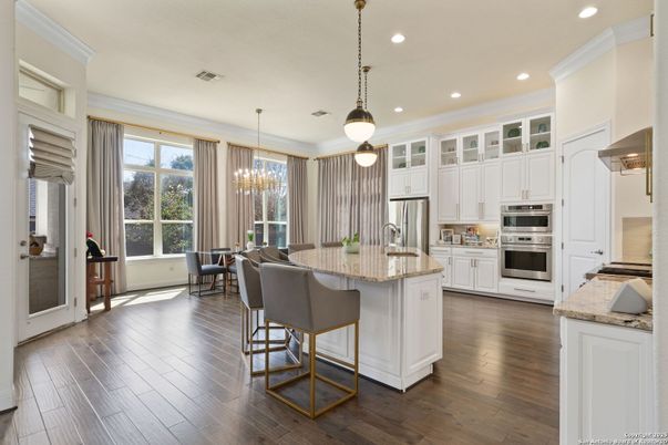 Dining room, Interior, Kitchen, Pendant Lights, Recessed Lighting, Stainless Steel Appliances, Wood Texture Flooring