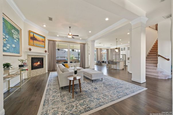 Dining room, Fireplace, Interior, Living room, Pendant Lights, Recessed Lighting, Wood Texture Flooring
