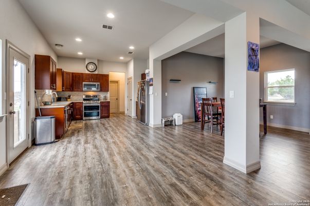 Dining room, Interior, Kitchen, Recessed Lighting, Stainless Steel Appliances, Wood Texture Flooring