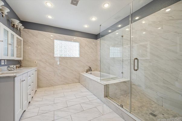 Bathroom, Dual Sink Vanities, Glass Shower, Interior, Marble, Marble Walls, Recessed Lighting