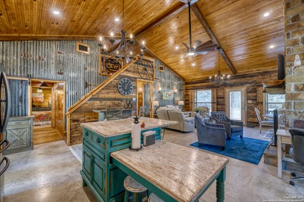 Chandelier, Dining room, Fireplace, Interior, Living room, Recessed Lighting, Stone Walls, Wooden Beams, Wooden Ceilings, Wood Texture Flooring, Wooden Walls